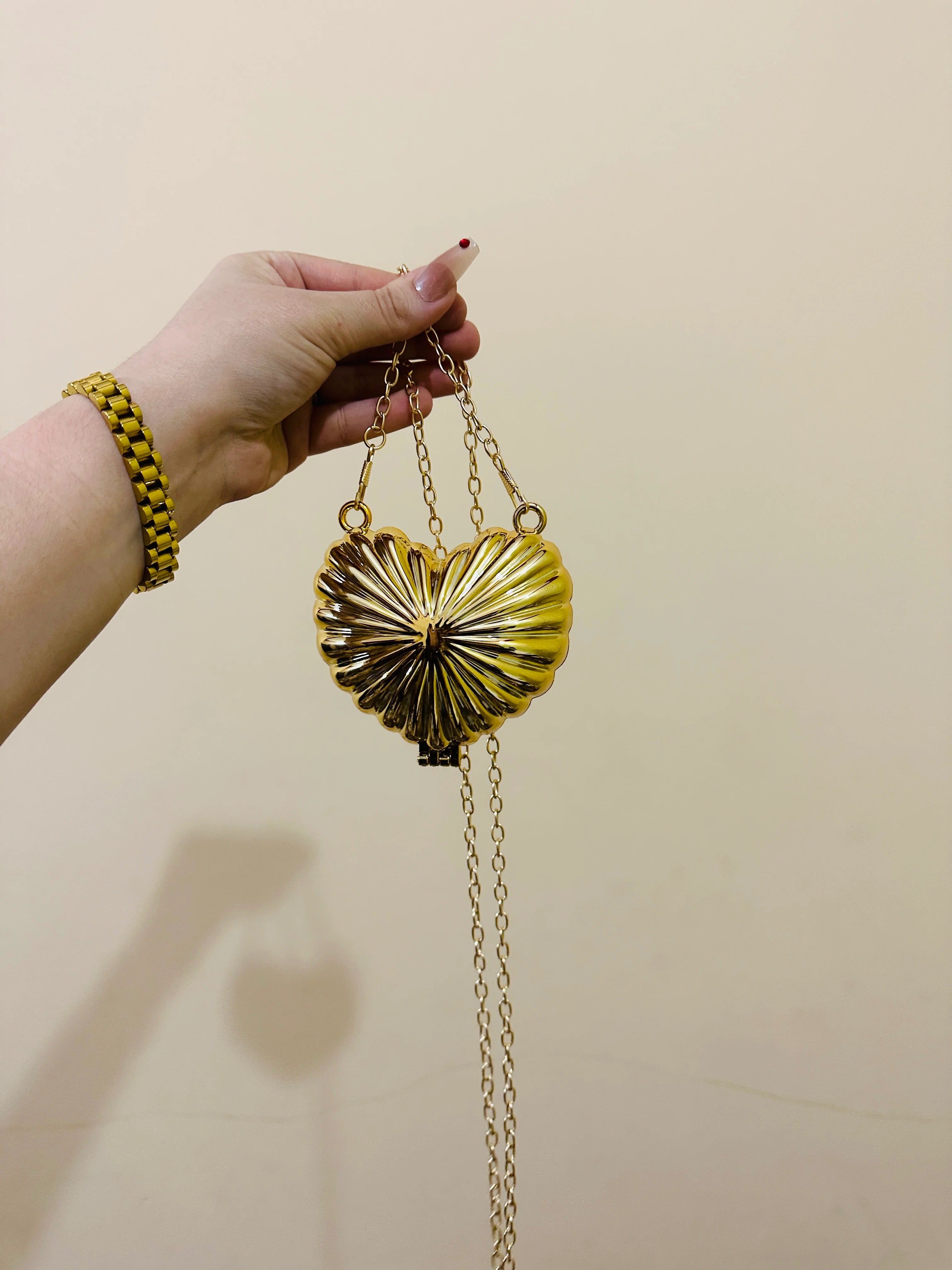 Golden heart clutch
