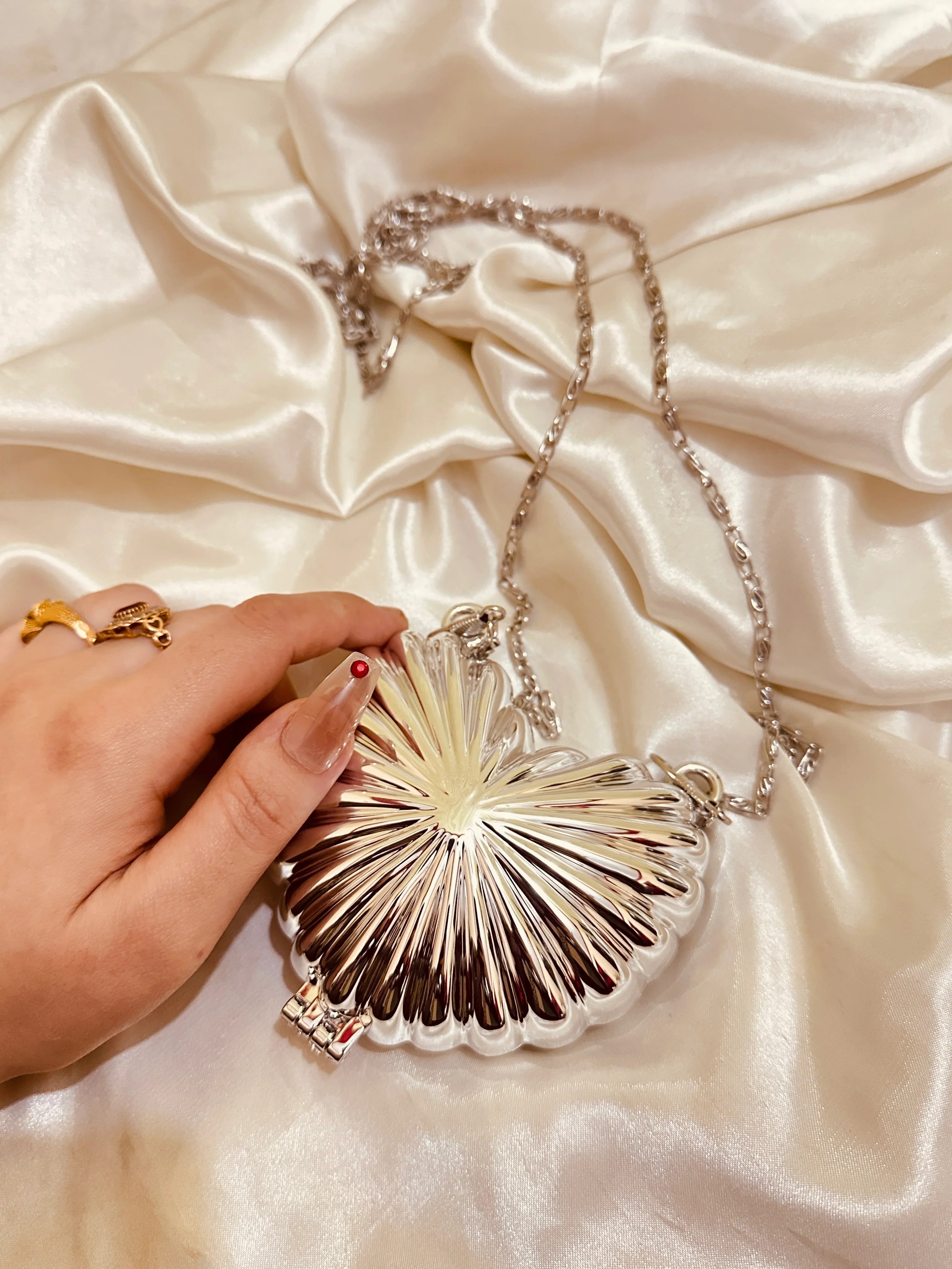 Golden heart clutch